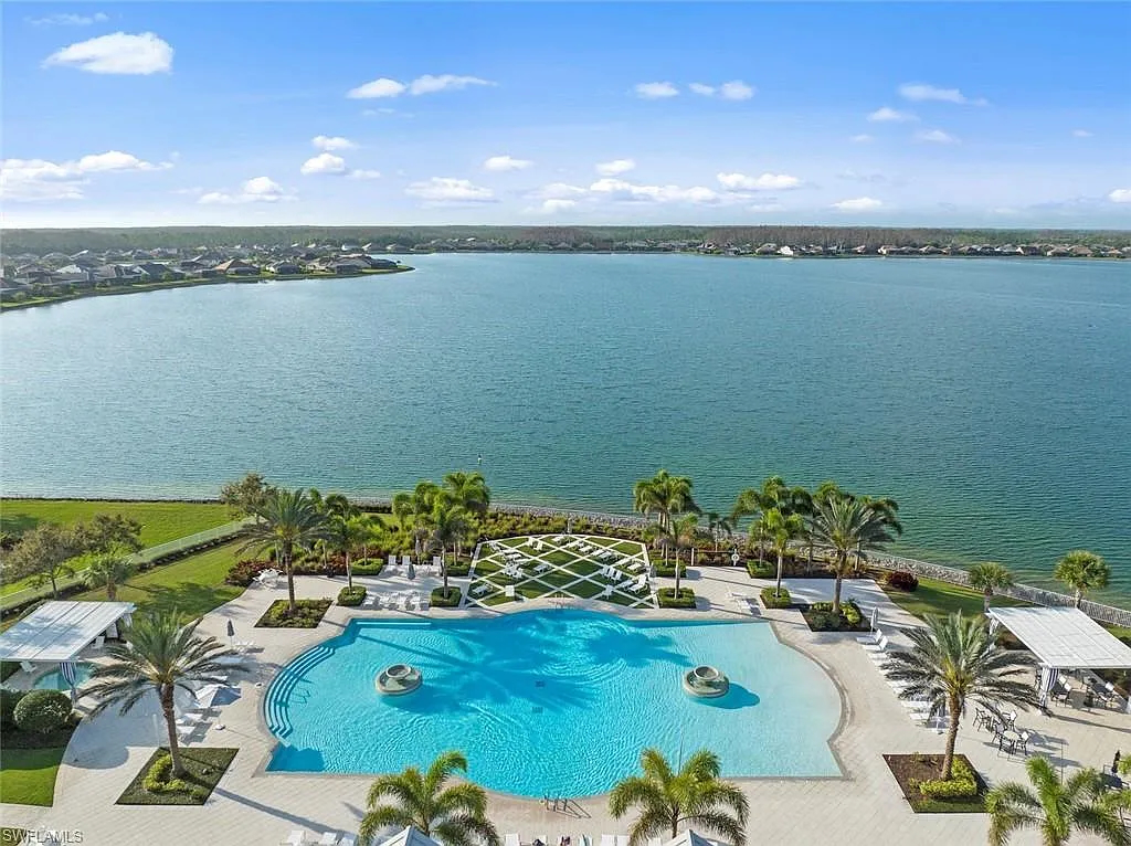 Aerial view of Corkscrew Shores resort pool and 240-acre lake in Estero, Florida